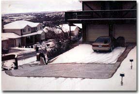 Steep driveway with electric radiant snow melting system installed.