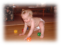 Baby playing on radiant heated hardwood floor