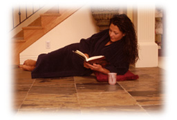 Woman reading on warm tile floor