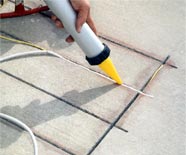 Applying sealant to a radiant heat retrofit installation