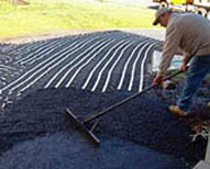 Retrofitting an asphalt driveway with snow melting cable.