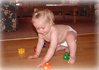 Baby playing on heated hardwood floor.