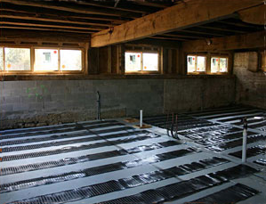 Low-voltage lectric floor heating system being installed.
