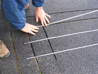 Asphalt driveway retrofitted with radiant snow melting cable