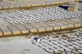 Driveway with electric radiant snow melting system being installed.