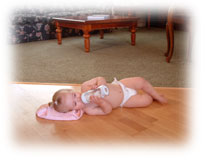 Baby on heated hardwood floor.